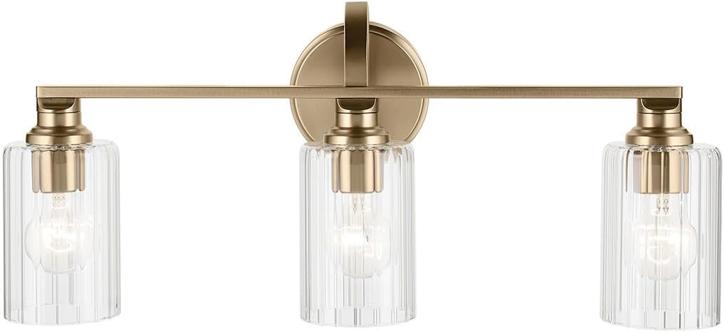 Kichler Gioe 24.25' 3-Light Bathroom Vanity Light Fixture with Clear Fluted Glass in Champagne Bronze, Damp Rated for Mirror, Powder Room (24.25' W x 10.5' H), 55226CPZFLU