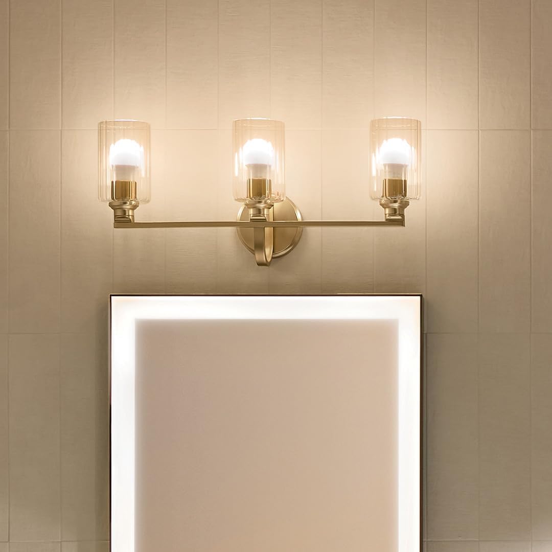 Kichler Gioe 24.25' 3-Light Bathroom Vanity Light Fixture with Clear Fluted Glass in Champagne Bronze, Damp Rated for Mirror, Powder Room (24.25' W x 10.5' H), 55226CPZFLU