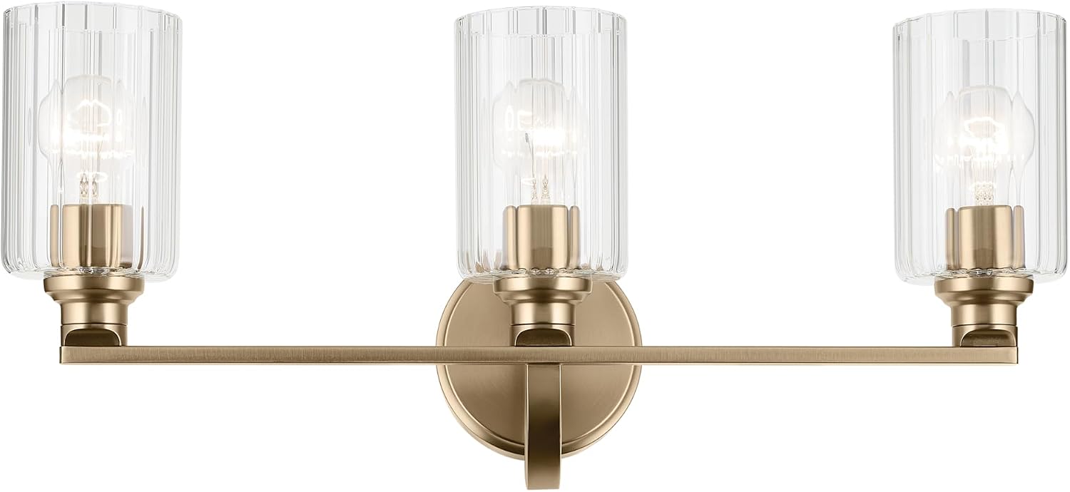 Kichler Gioe 24.25' 3-Light Bathroom Vanity Light Fixture with Clear Fluted Glass in Champagne Bronze, Damp Rated for Mirror, Powder Room (24.25' W x 10.5' H), 55226CPZFLU