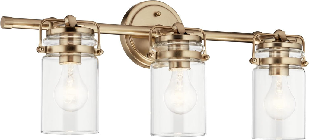 Kichler Brinley 24' 3-Light Bathroom Vanity Light Fixture with Clear Glass in Champagne Bronze, Modern Farmhouse Mason Jar Style for Mirror Lighting (24' W x 10.25' H), 45689CPZ