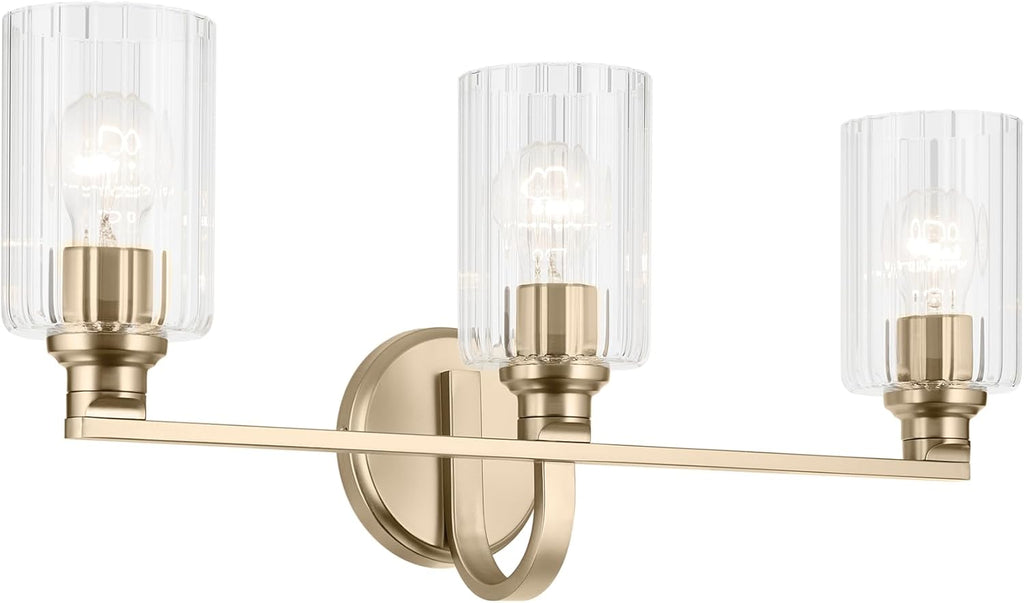 Kichler Gioe 24.25' 3-Light Bathroom Vanity Light Fixture with Clear Fluted Glass in Champagne Bronze, Damp Rated for Mirror, Powder Room (24.25' W x 10.5' H), 55226CPZFLU