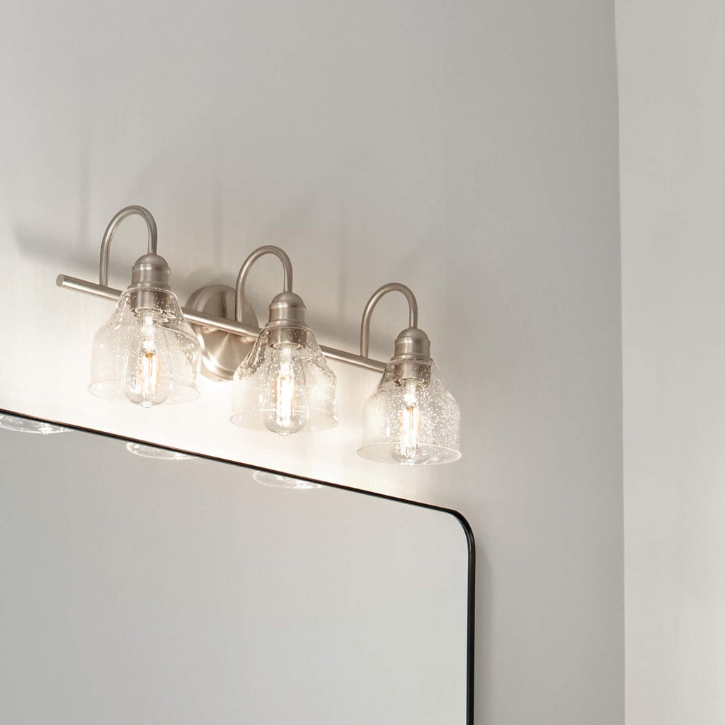 Kichler Avery 24' 3 Light Bathroom Vanity Light in Brushed Nickel, Vintage Bathroom Wall Mount Fixture with Clear Seeded Glass, (24' W x 9.25' H), 45973NI