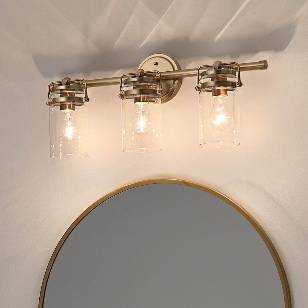 Kichler Brinley 24' 3-Light Bathroom Vanity Light Fixture with Clear Glass in Champagne Bronze, Modern Farmhouse Mason Jar Style for Mirror Lighting (24' W x 10.25' H), 45689CPZ