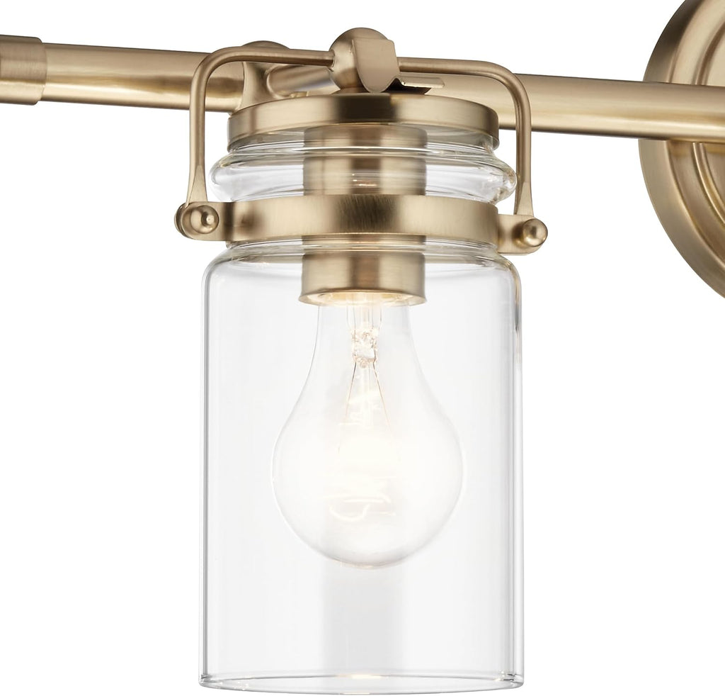 Kichler Brinley 24' 3-Light Bathroom Vanity Light Fixture with Clear Glass in Champagne Bronze, Modern Farmhouse Mason Jar Style for Mirror Lighting (24' W x 10.25' H), 45689CPZ