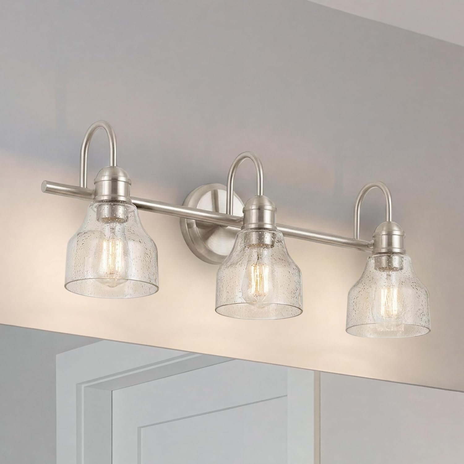 Kichler Avery 24' 3 Light Bathroom Vanity Light in Brushed Nickel, Vintage Bathroom Wall Mount Fixture with Clear Seeded Glass, (24' W x 9.25' H), 45973NI