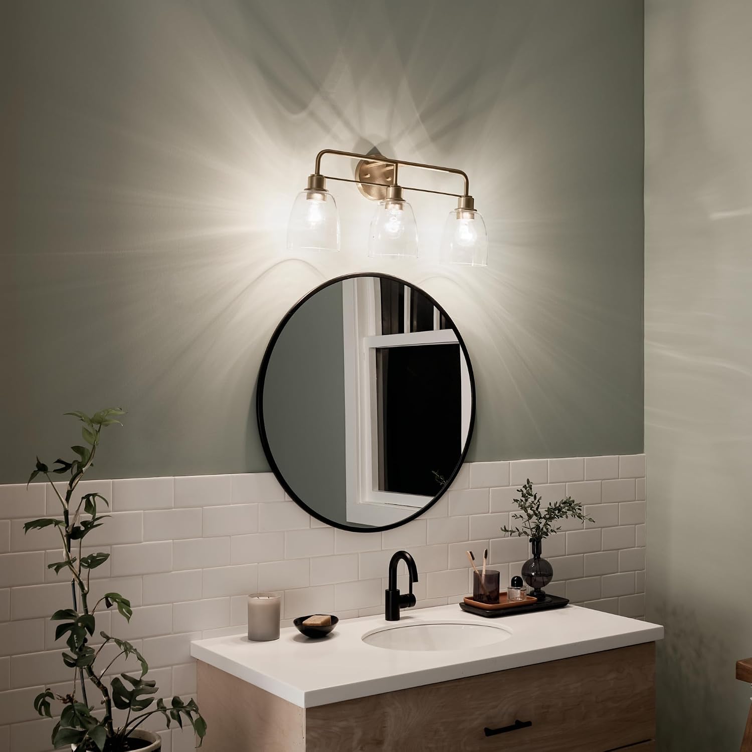 Kichler Meller 24.25' 3-Light Bathroom Vanity Light Fixture with Clear Glass Shades in Champagne Bronze for Mirror or Powder Room (24.25' W x 11.25' H x 7' D) 55102CPZ