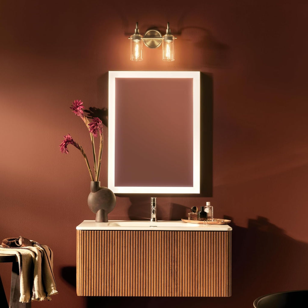 Kichler Kavi 12.5' 2-Light Bathroom Vanity Light Fixture with Clear Glass in Champagne Bronze, Modern Wall Mount Over Mirror for Powder Room, Damp Rated (12.5' W x 10' H), 55210CPZ