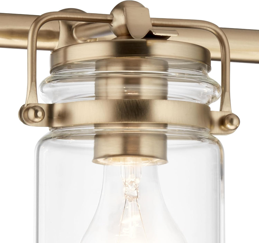 Kichler Brinley 24' 3-Light Bathroom Vanity Light Fixture with Clear Glass in Champagne Bronze, Modern Farmhouse Mason Jar Style for Mirror Lighting (24' W x 10.25' H), 45689CPZ