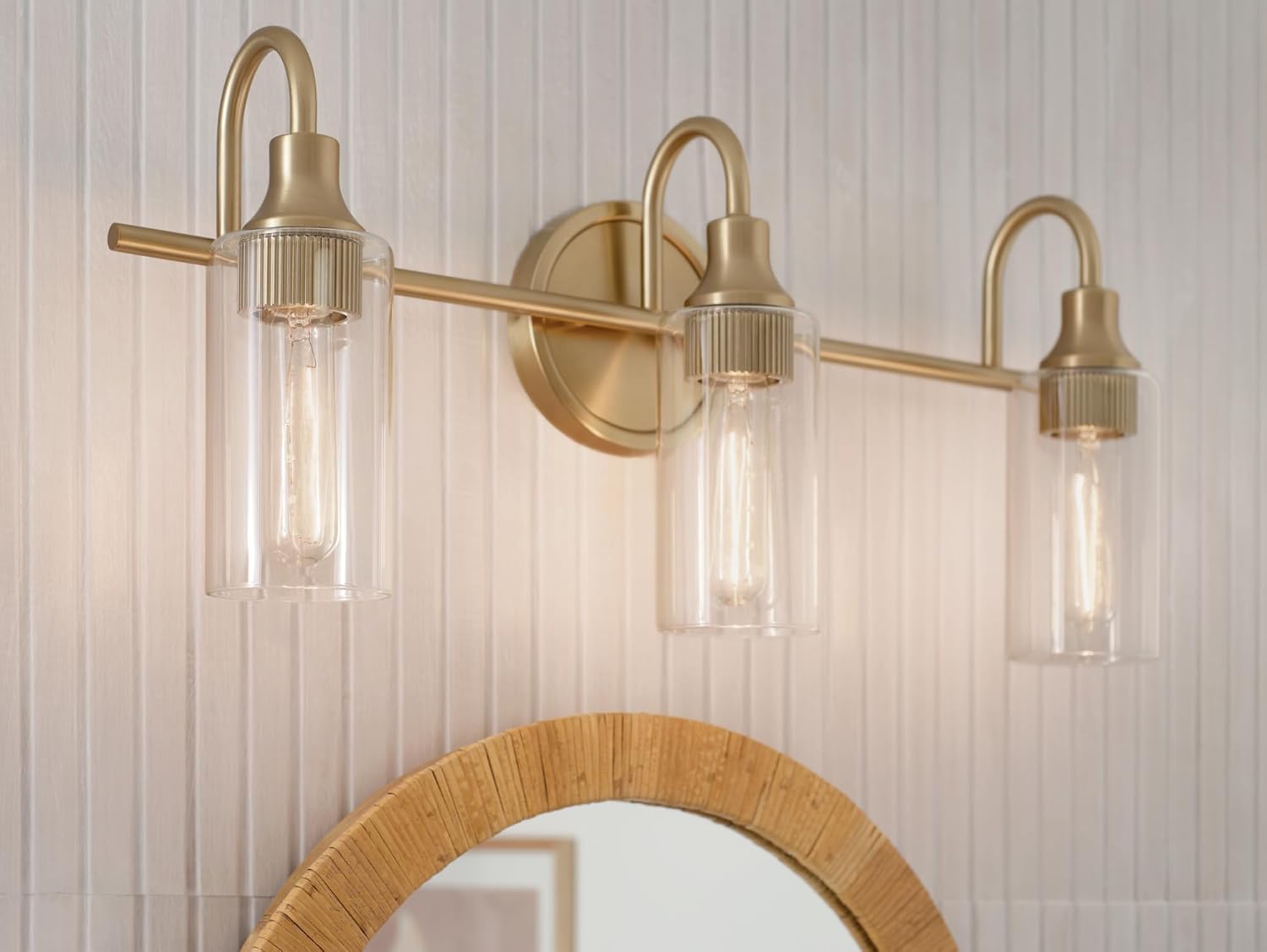 Kichler Kavi 23' 3-Light Bathroom Vanity Light Fixture with Clear Glass in Champagne Bronze, Modern Wall Mount Over Mirror for Powder Room (23' W x 10' H), 55211CPZ