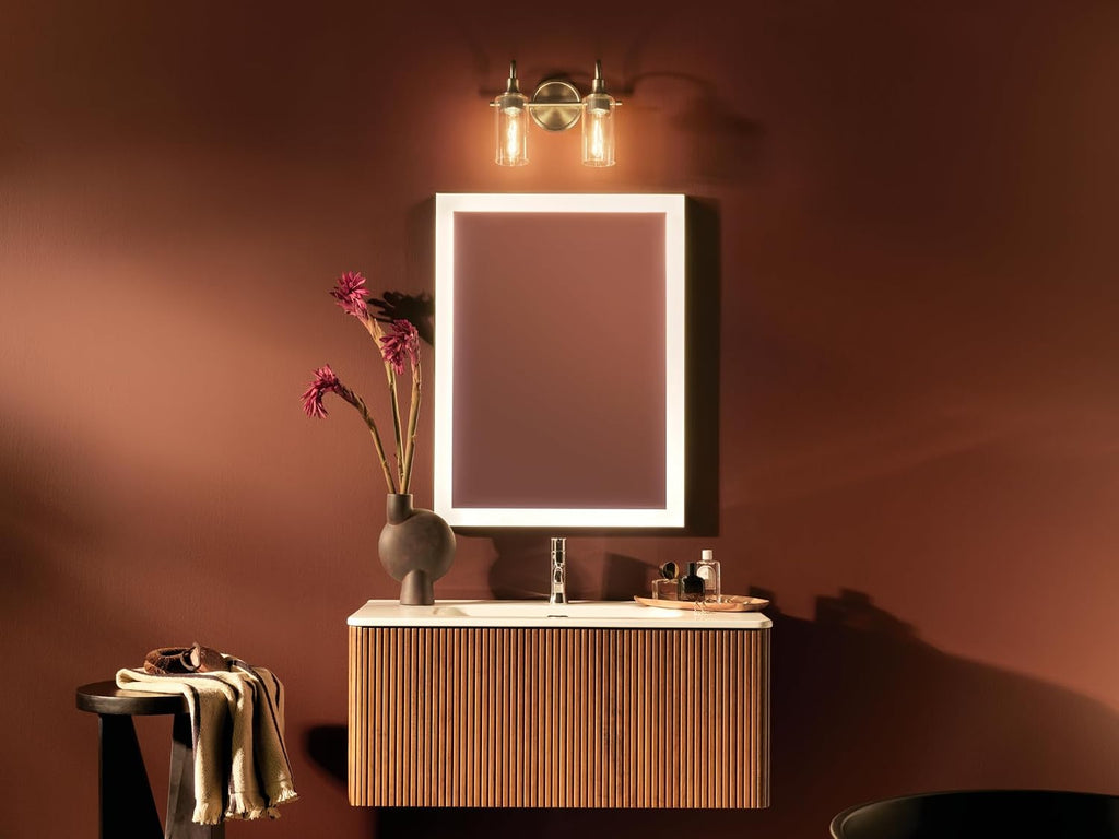 Kichler Kavi 12.5' 2-Light Bathroom Vanity Light Fixture with Clear Glass in Champagne Bronze, Modern Wall Mount Over Mirror for Powder Room, Damp Rated (12.5' W x 10' H), 55210CPZ