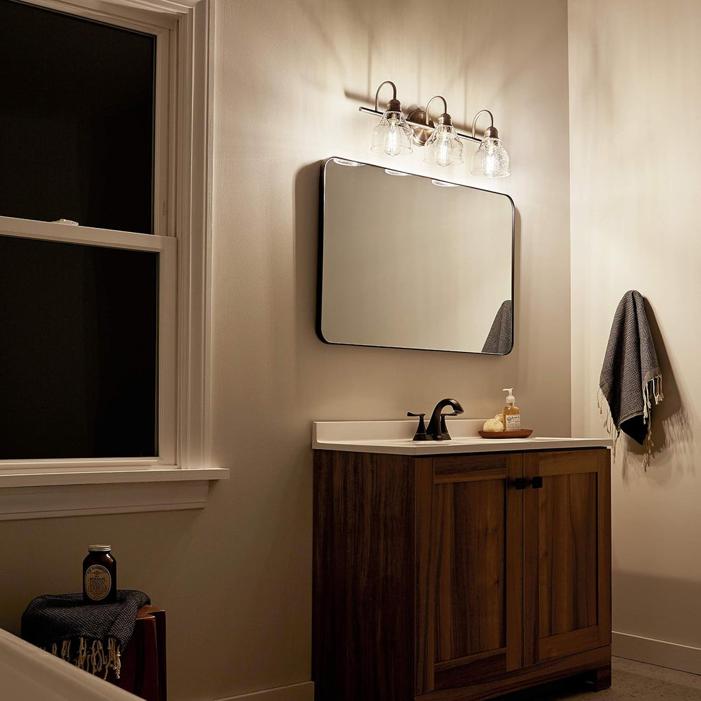 Kichler Avery 24' 3 Light Bathroom Vanity Light in Brushed Nickel, Vintage Bathroom Wall Mount Fixture with Clear Seeded Glass, (24' W x 9.25' H), 45973NI